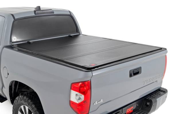 Rough Country - Hard Tri-Fold Flip Up Bed Cover - 5'7 in. Bed - Toyota Tundra 2WD/4WD (07-21) | 49414551 - Image 1
